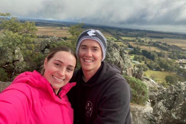 Marnie Wills smiling with her fiance Bailey post cancer treatment